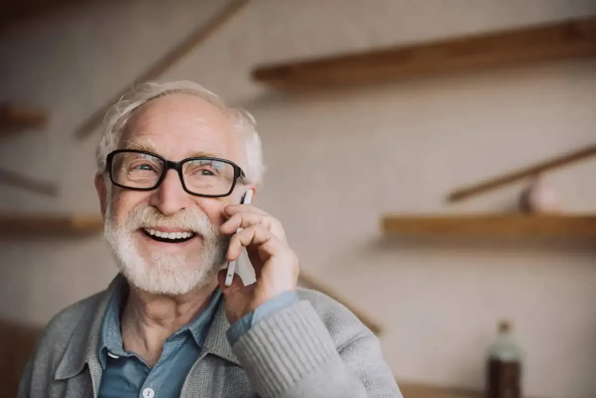 A smiling homeowner talking with us on the phone